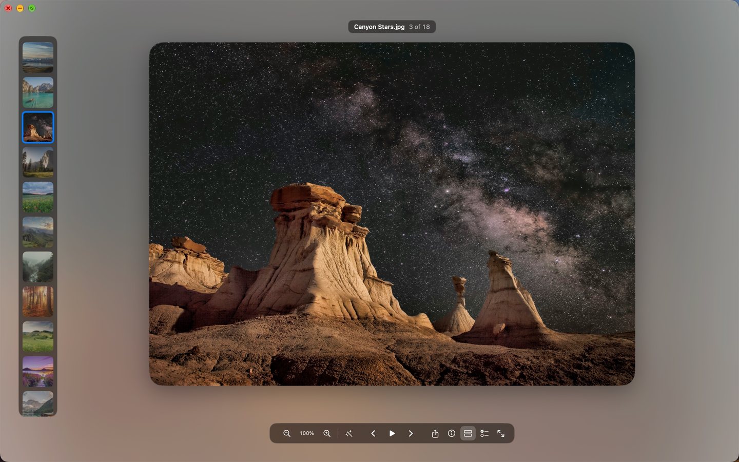 The viewer with a filmstrip of thumbnails down the left edge and a night-sky photo in the centre.