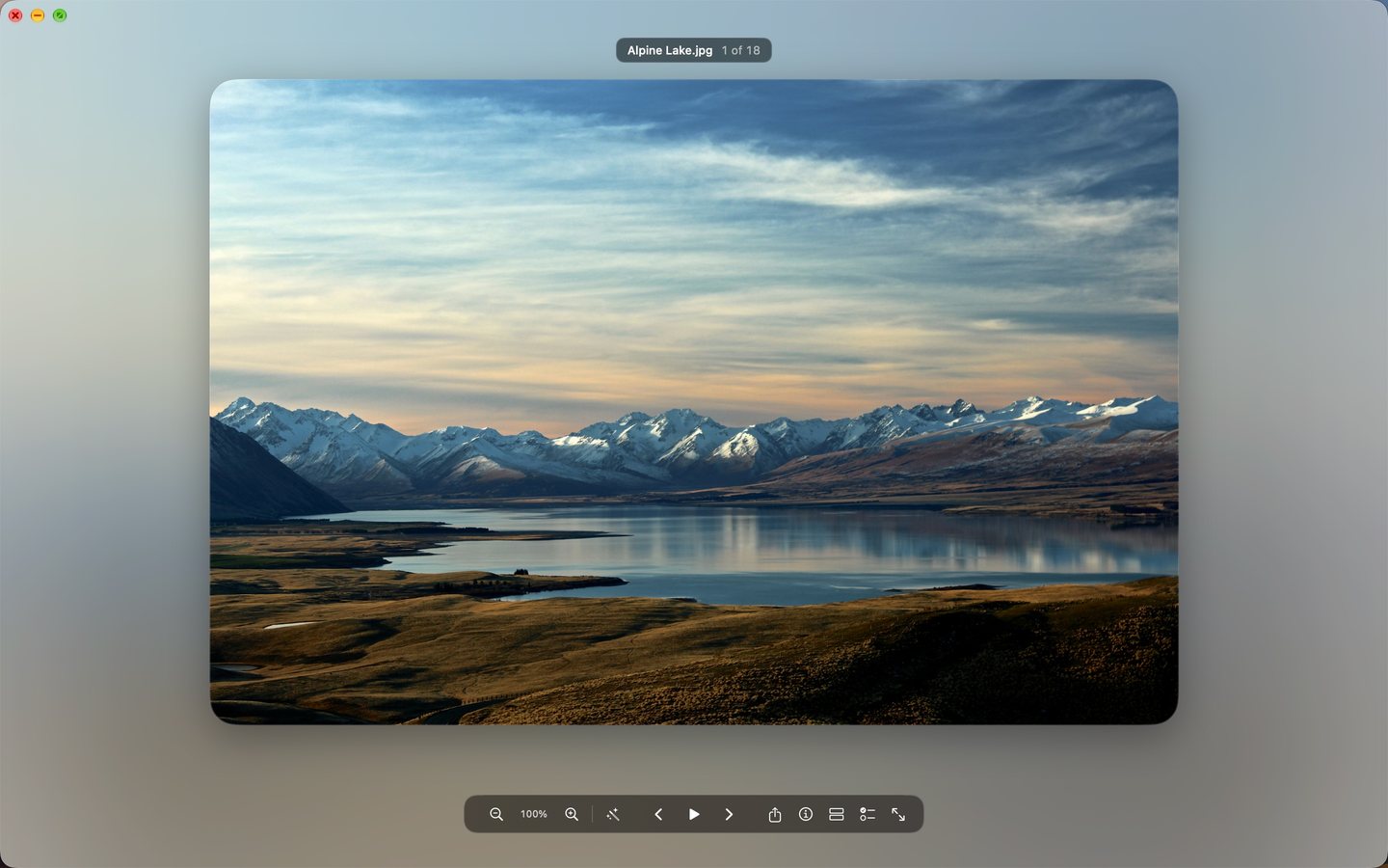 The viewer showing a mountain lake, with the file name at the top and a control bar at the bottom.